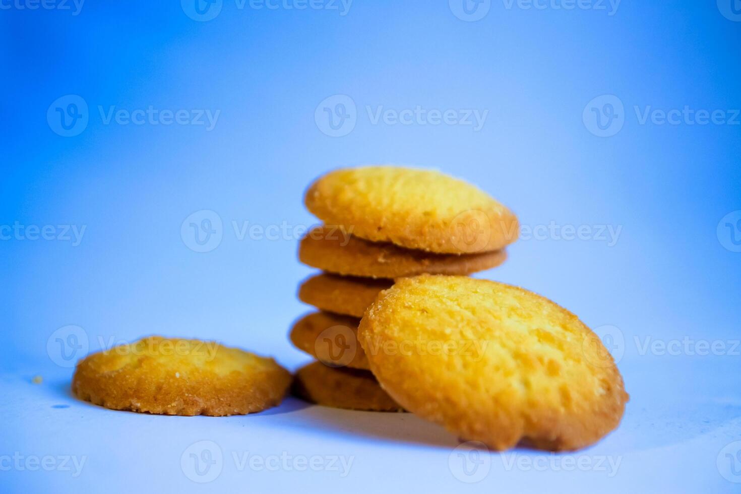 Danish butter cookies, stack of golden chocolate butter cookies isolated on white background, sweet pastry photo