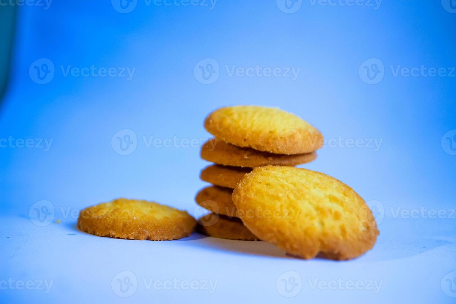Danish butter cookies, stack of golden chocolate butter cookies isolated on white background, sweet pastry photo