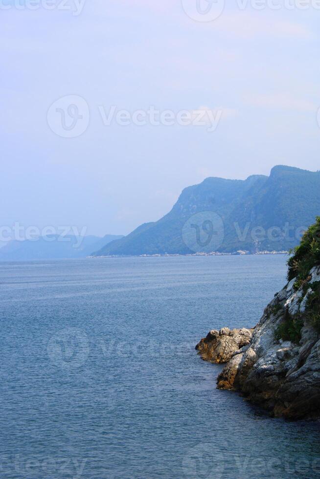 An island in the middle of the sea and the rocks next to it. Amasra, Bartin, Turkey photo