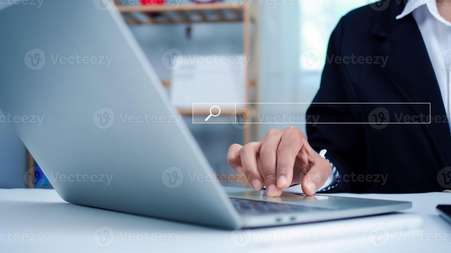 Business woman hand working on computer and search icon. The concept of searching for information from the internet network. photo