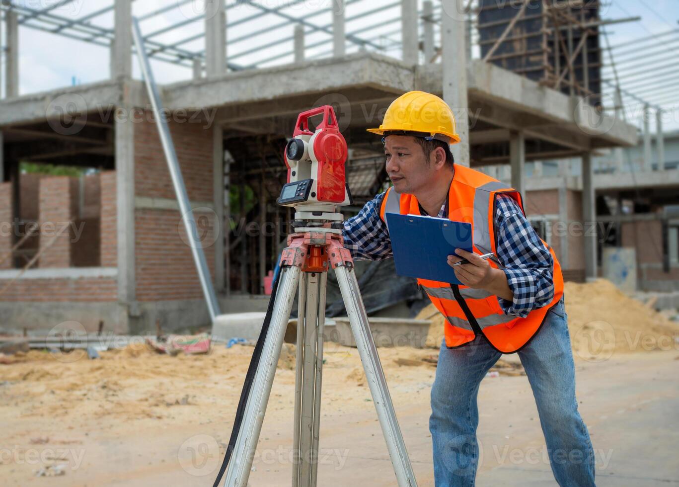 Civil engineer or Architect working surveyor, Surveyor and survey equipment on construction site, Land and soil development, Survey equipment, Theodolite for measurement construction work. photo