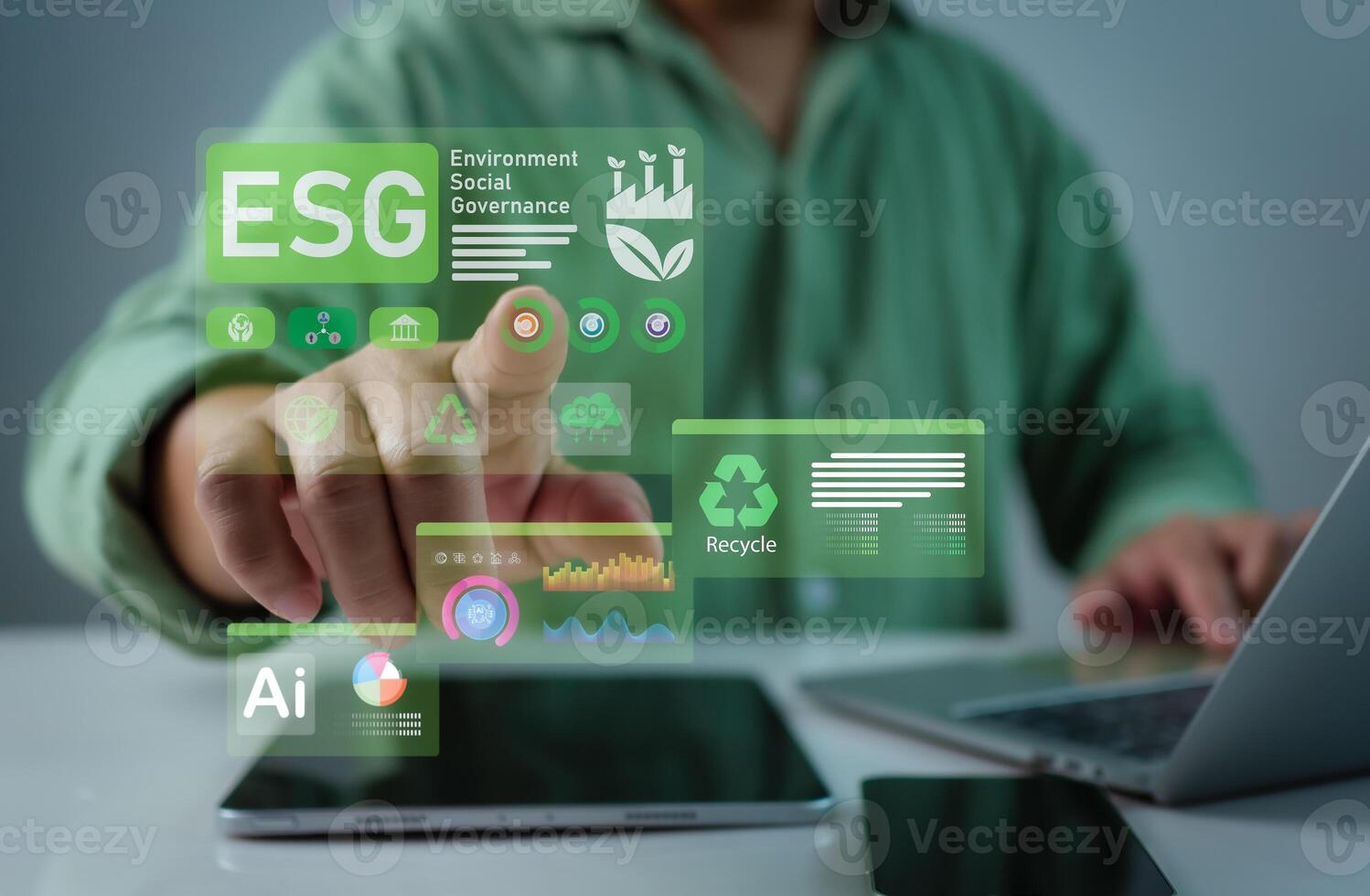 Businessman using computer and tablet to analyze investment concept, ESG, Environment social governance investment business concept, Social business strategy, Environment, Sustainability-related risks photo