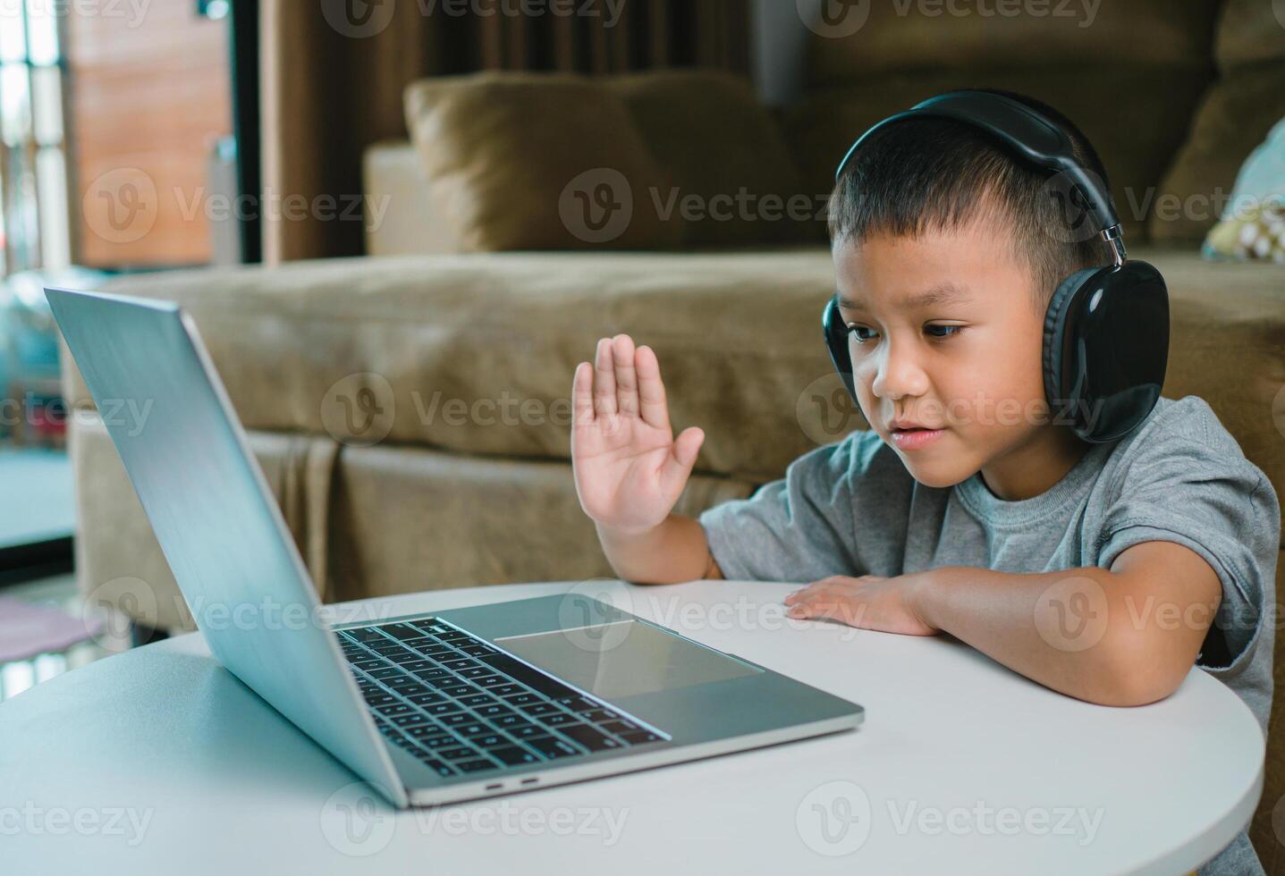 Online education, Technology studying at home using laptop computer, Student distance learning virtual distance online class on call virtual lesson, Teaching child boy with remote education. photo