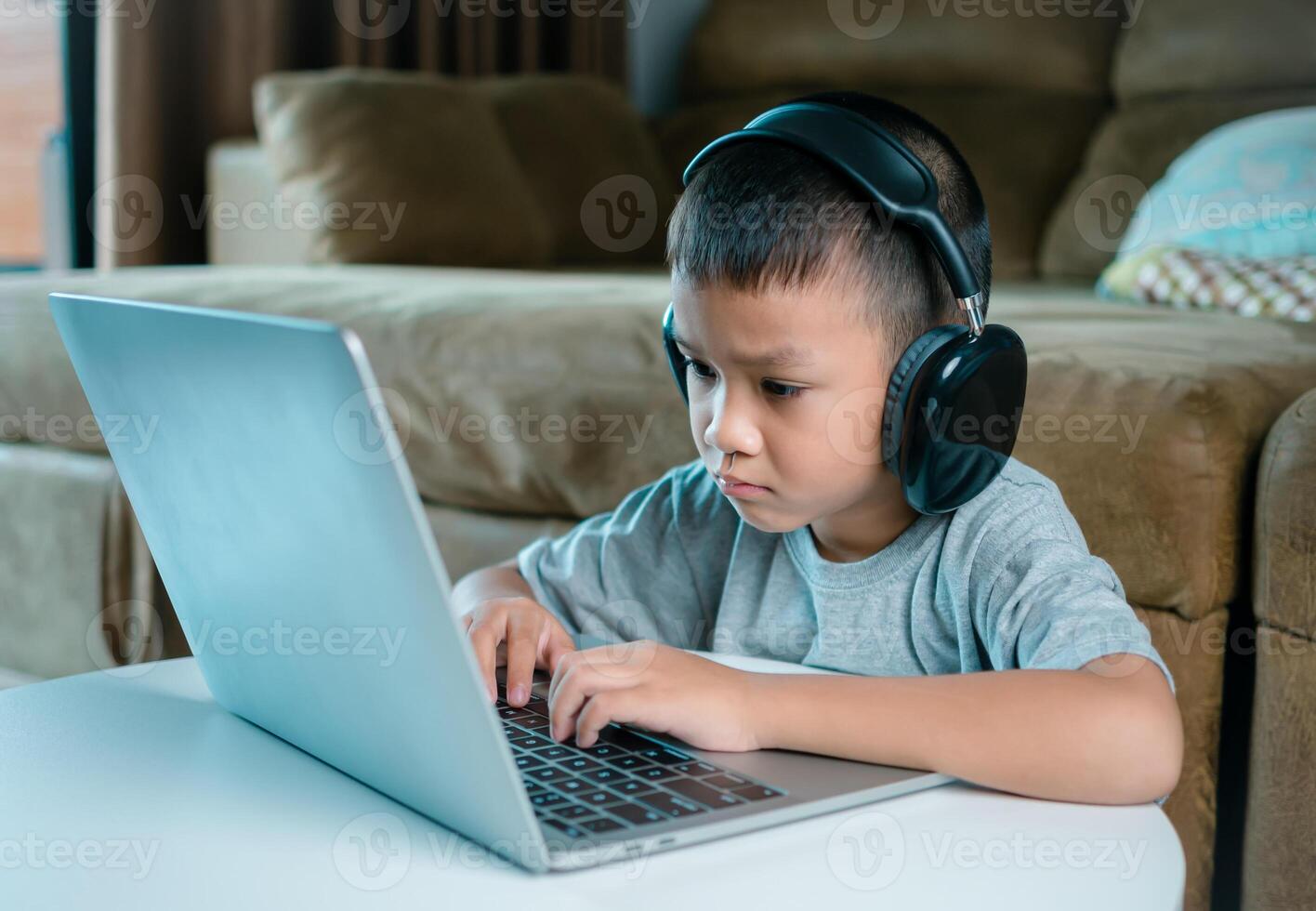 Online education, Technology studying at home using laptop computer, Student distance learning virtual distance online class on call virtual lesson, Teaching child boy with remote education. photo