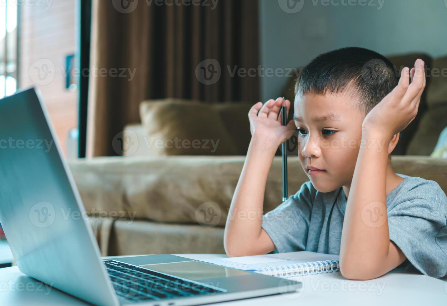Technology studying at home using laptop computer, Student distance learning virtual distance online class on call virtual lesson, Parent or tutor teaching child boy with remote education. photo