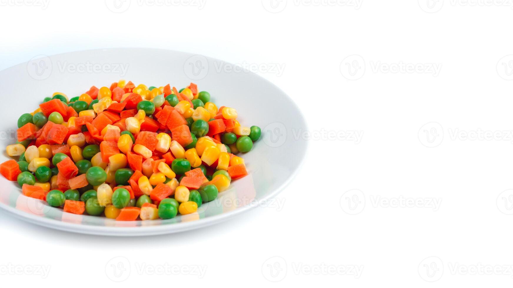 Organic Food. Mixed Vegetables Isolated White Background. Vegetable containing carrots, peas, and corn on white background, Healthy food, Colorful mixed vegetables. photo