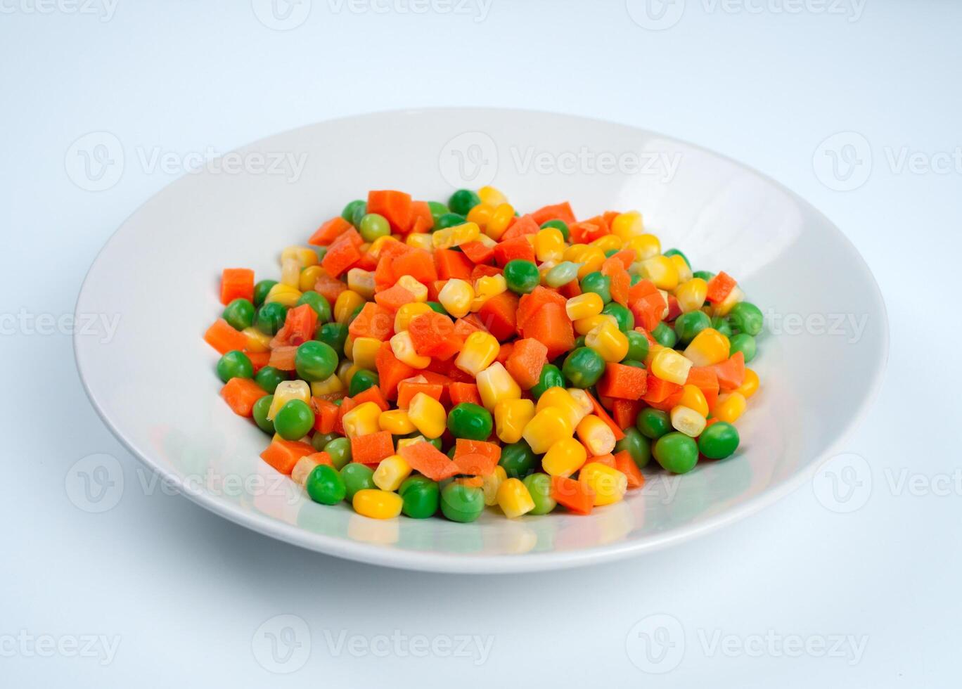 Organic Food. Mixed Vegetables Isolated White Background. Vegetable containing carrots, peas, and corn on white background, Healthy food, Colorful mixed vegetables. photo