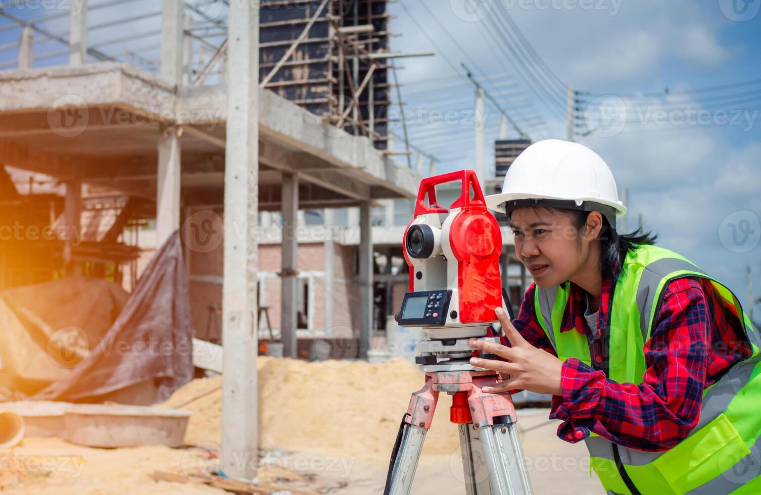 Surveyor and survey equipment on construction site, Land and soil development, Survey equipment, Theodolite for measurement construction work, Civil engineer or Architect working surveyor. photo