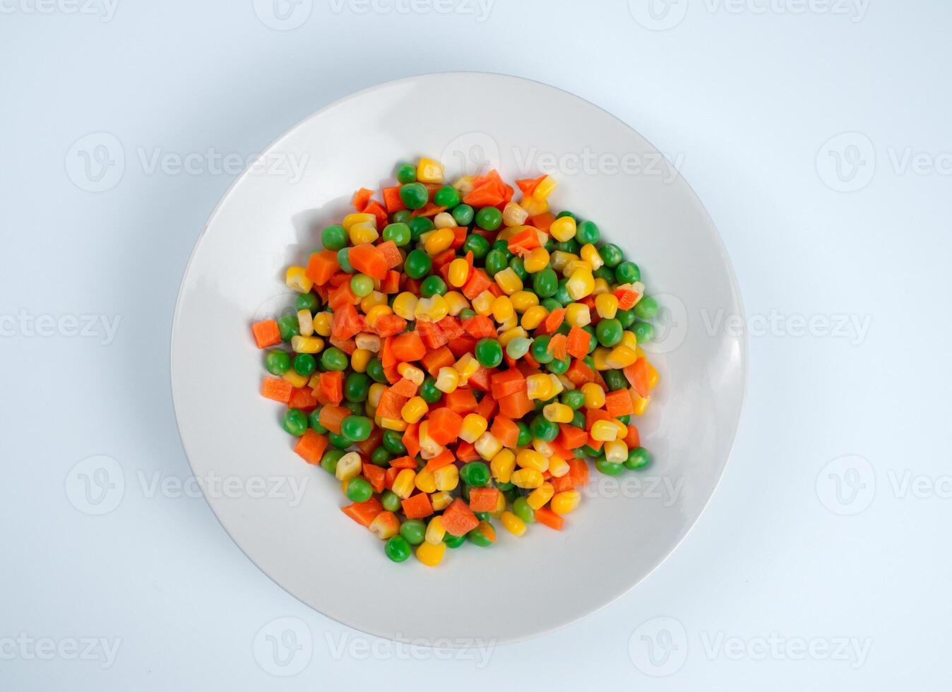 Organic Food. Mixed Vegetables Isolated White Background. Vegetable containing carrots, peas, and corn on white background, Healthy food, Colorful mixed vegetables. photo
