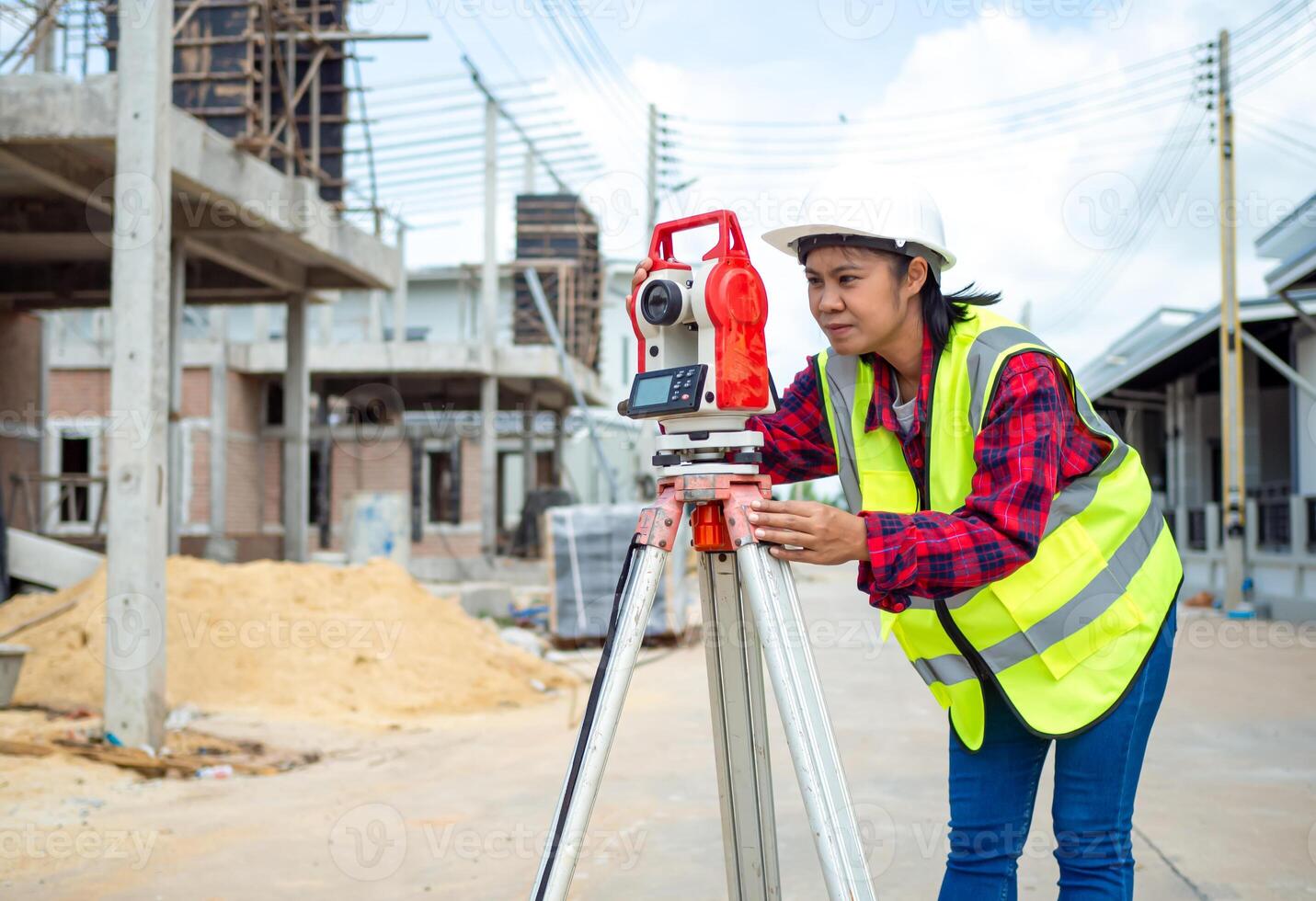 Surveyor and survey equipment on construction site, Land and soil development, Survey equipment, Theodolite for measurement construction work, Civil engineer or Architect working surveyor. photo