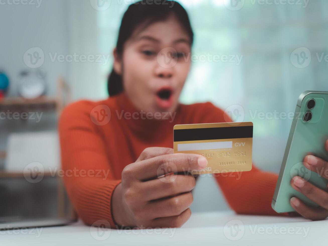 Happy woman with credit card using smart phone and shopping online, Online banking transaction, Ecommerce and secure mobile banking concept, Making online payments. photo