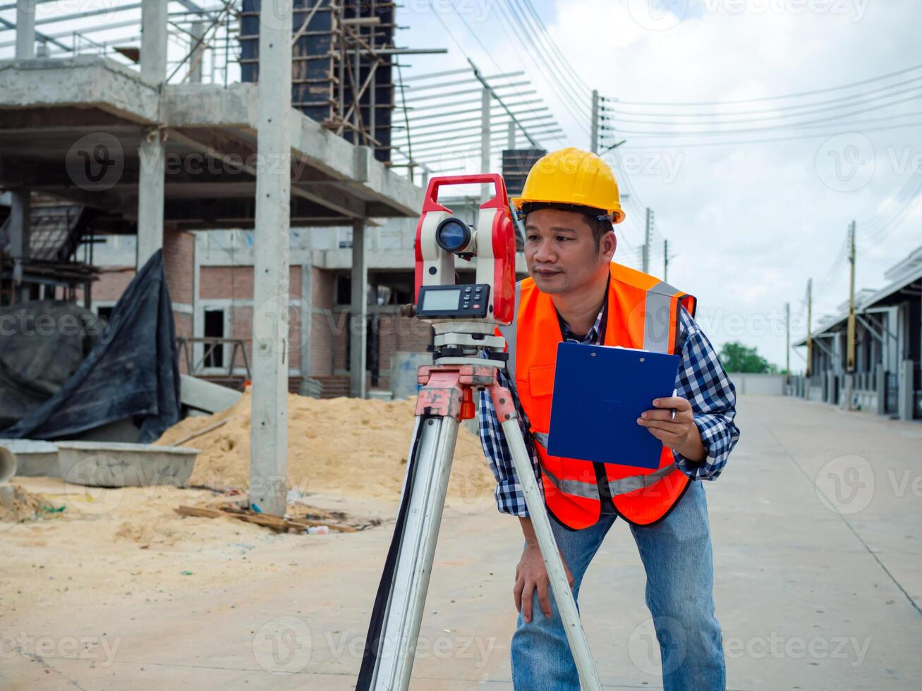 Surveyor and survey equipment on construction site, Land and soil development, Survey equipment, Theodolite for measurement construction work, Civil engineer or Architect working surveyor. photo