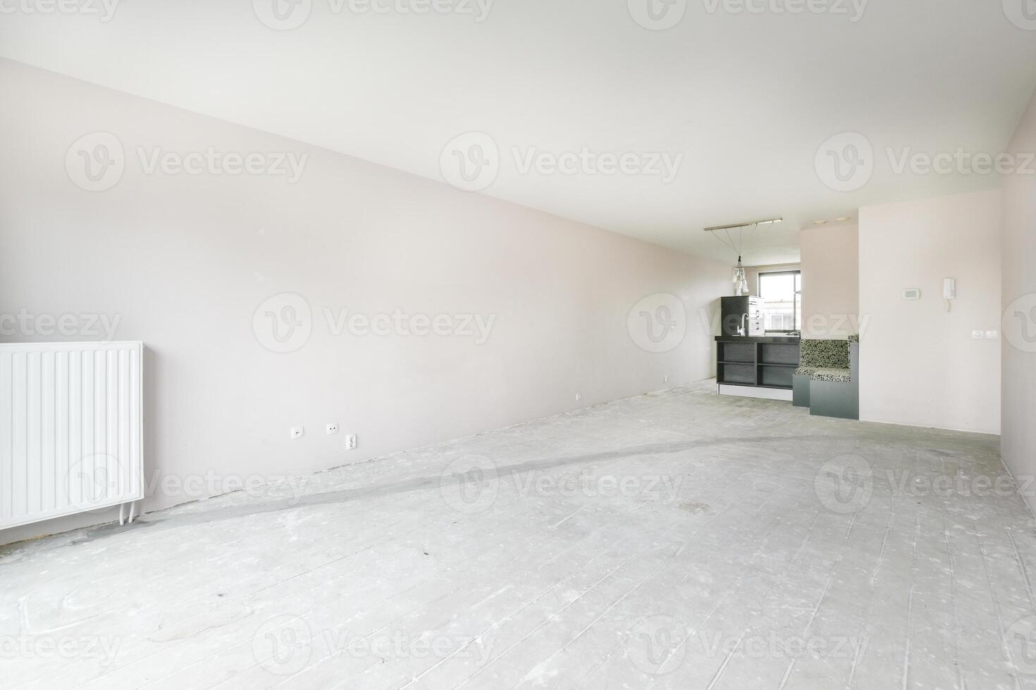 Empty room with white walls and a radiator photo