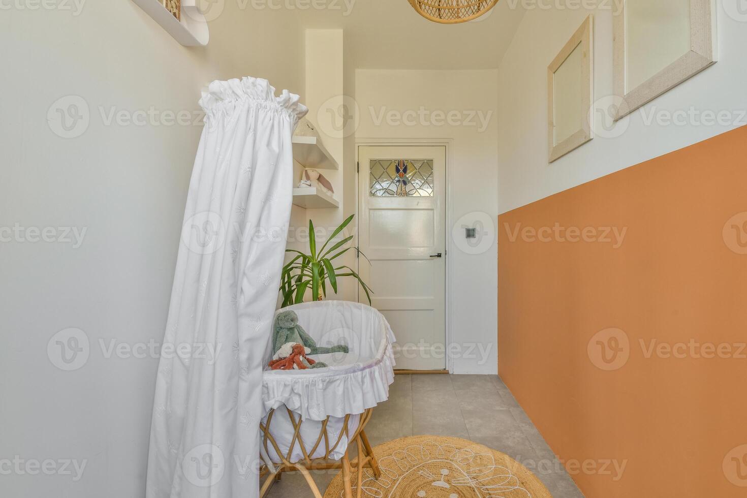 A hallway with orange walls and white curtains photo