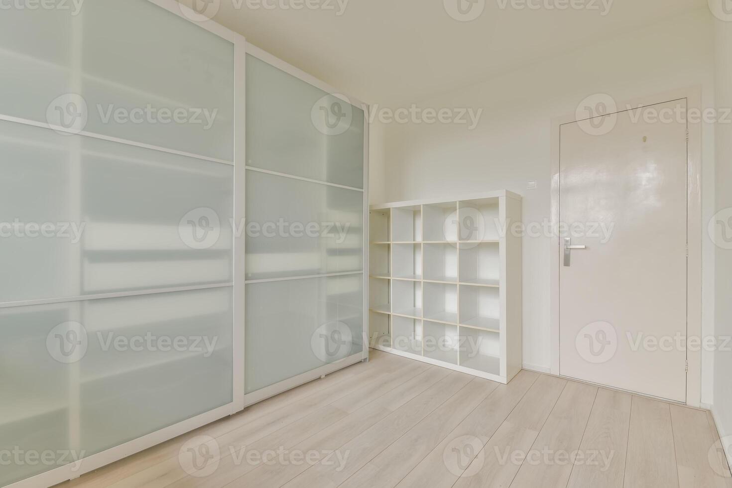 Empty room with white walls and shelves photo