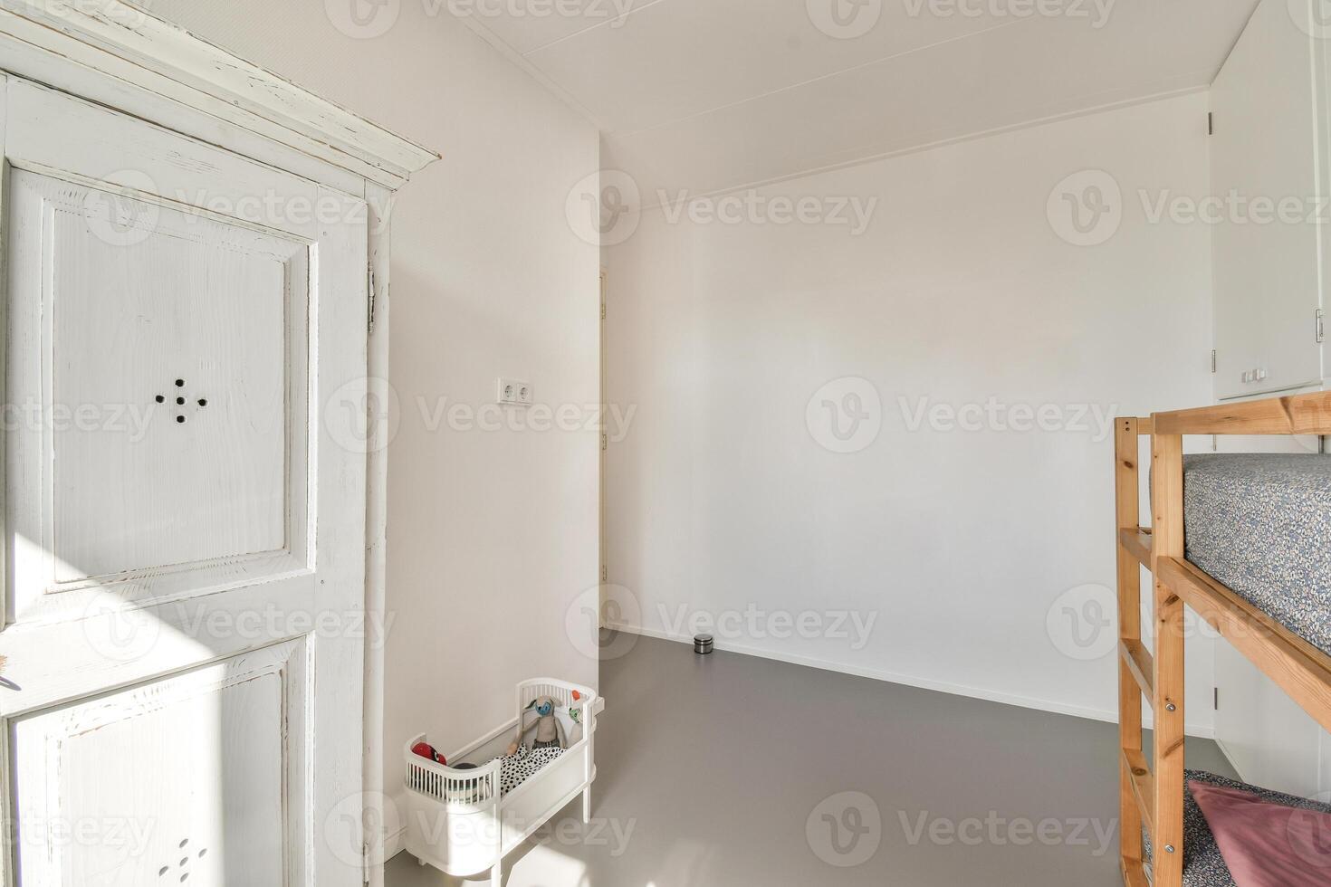 A room with a bunk bed and a door photo