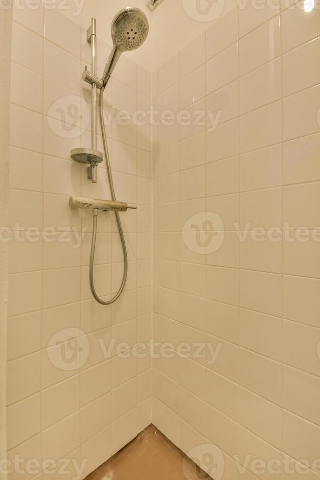 A shower head in a bathroom photo