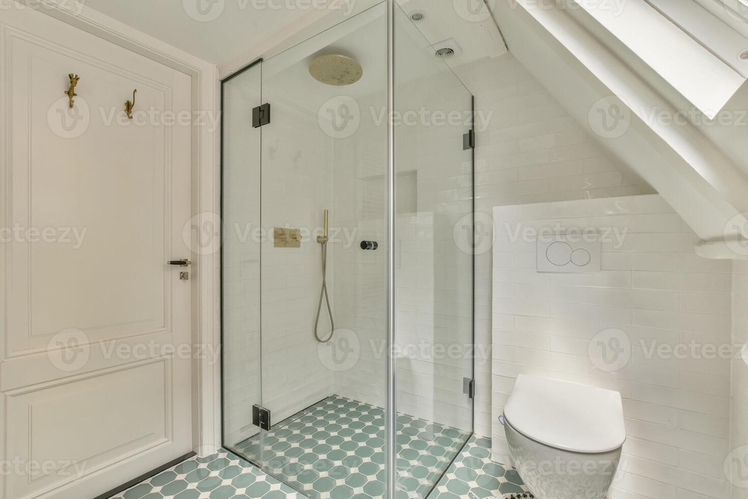 A bathroom with a glass shower and toilet photo