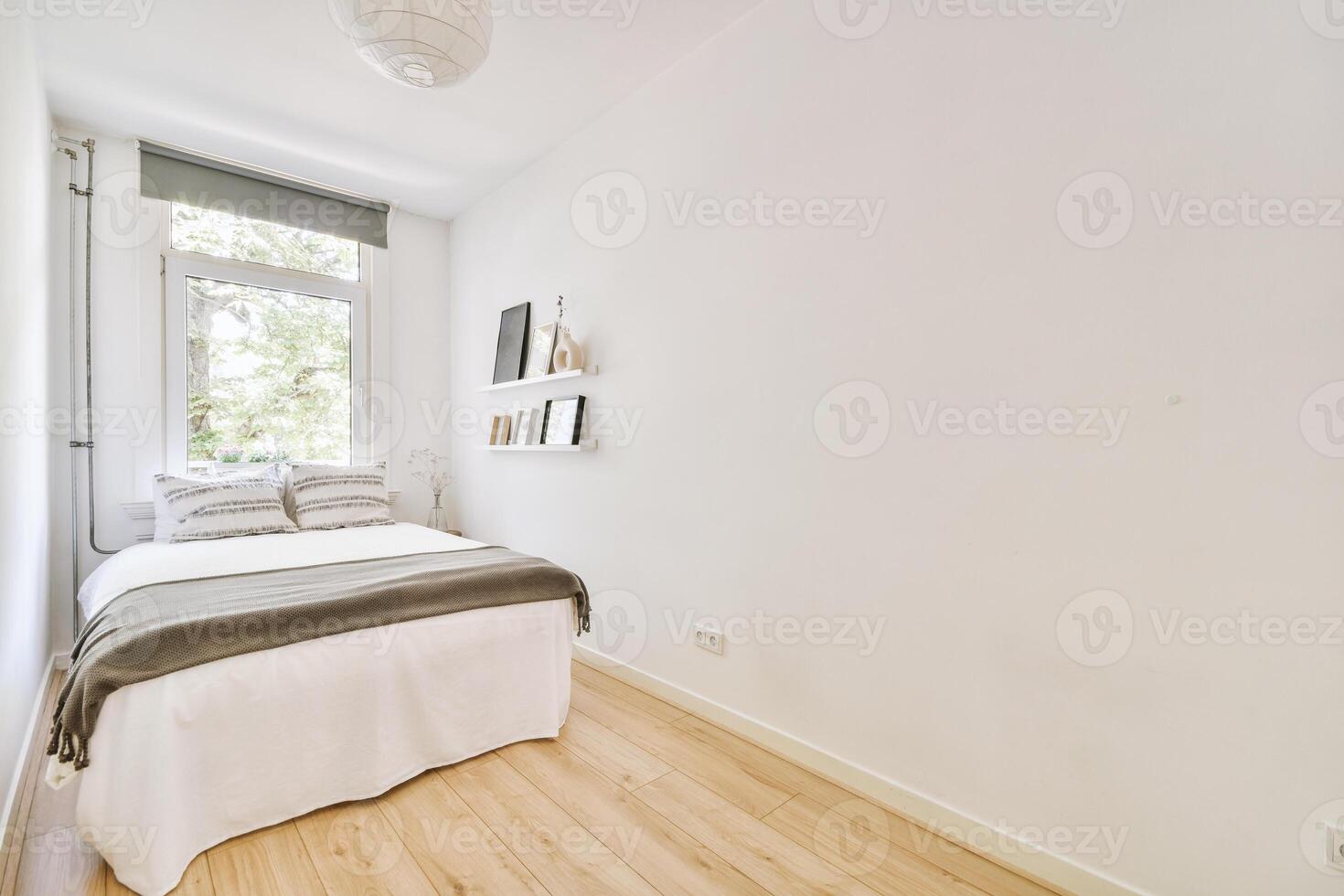 A bedroom with a bed and a window photo