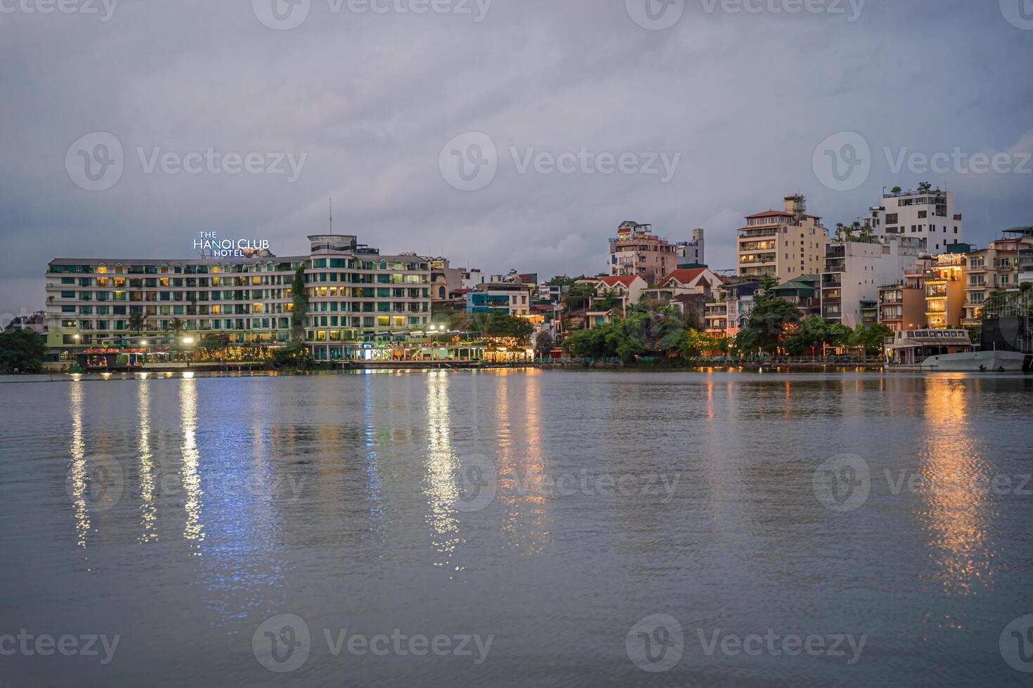 Hanoi, Vietnam - 25 Jun 2024 West Lake in Hanoi in the dark cloudy evening. Ha Noi cityscape. Travel concept photo