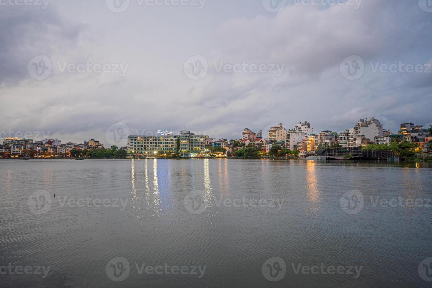 Hanoi, Vietnam - 25 Jun 2024 West Lake in Hanoi in the dark cloudy evening. Ha Noi cityscape. Travel concept photo