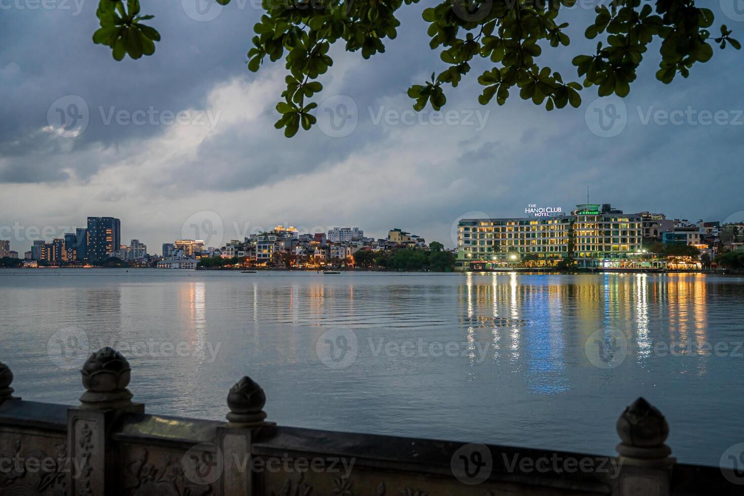Hanoi, Vietnam - 25 Jun 2024 West Lake in Hanoi in the dark cloudy evening. Ha Noi cityscape. Travel concept photo