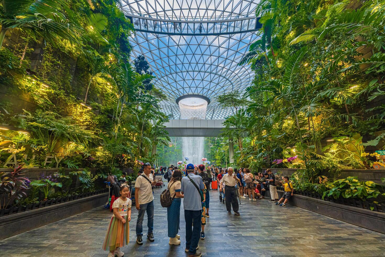 Singapore - Jun 13 2024 The Rain Vortex, a 40m-tall indoor waterfall located inside the Jewal Changi Airport in Singapore. Travel concept photo
