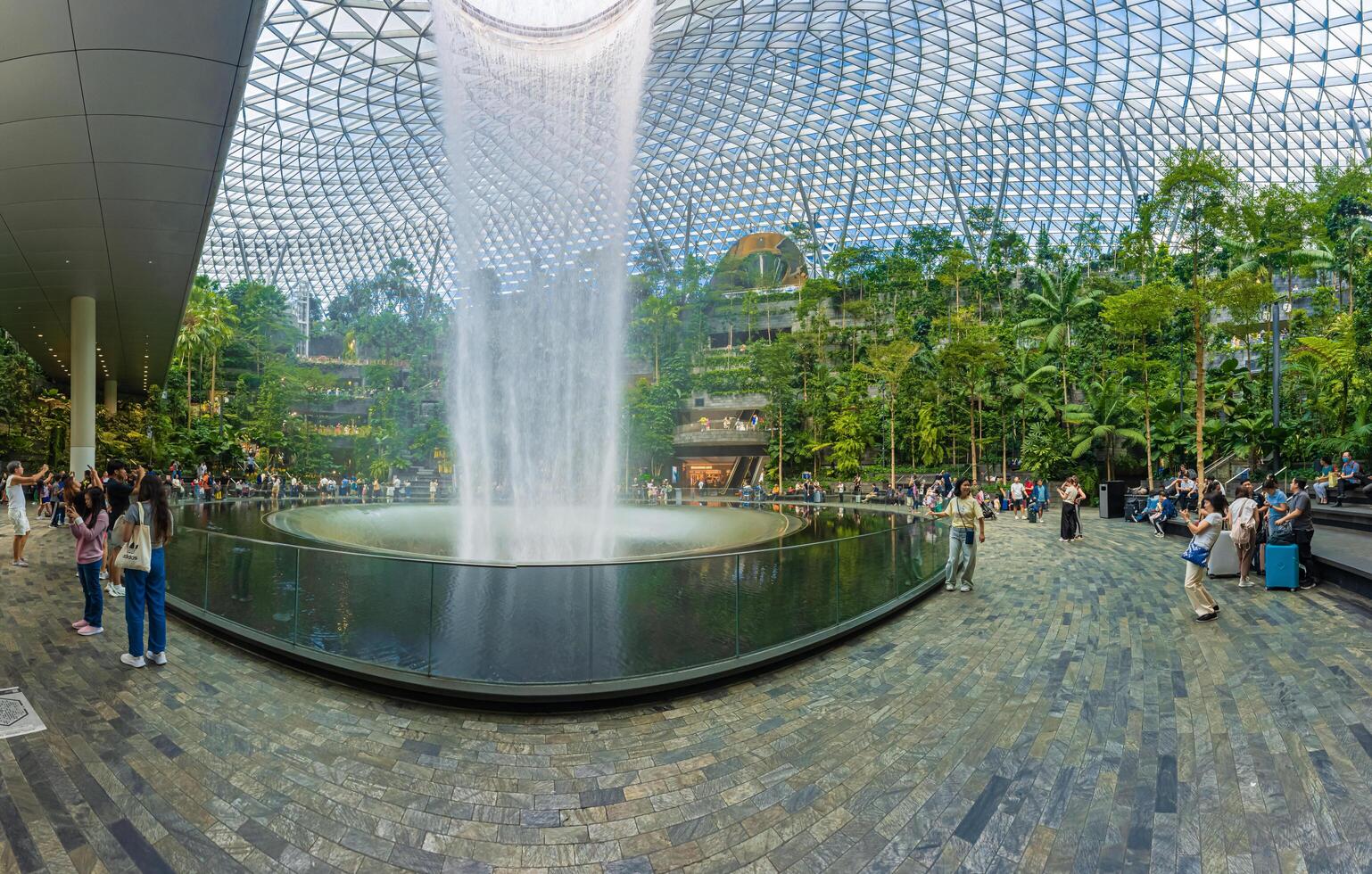 Singapore - Jun 13 2024 The Rain Vortex, a 40m-tall indoor waterfall located inside the Jewal Changi Airport in Singapore. Travel concept photo
