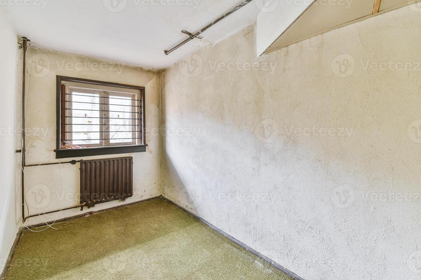 A room with a radiator and a window photo