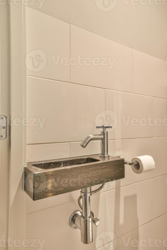 A bathroom with a sink and a toilet photo