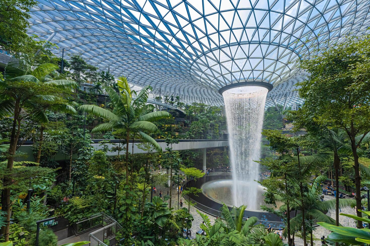 Singapore - Jun 13 2024 The Rain Vortex, a 40m-tall indoor waterfall located inside the Jewal Changi Airport in Singapore. Travel concept photo