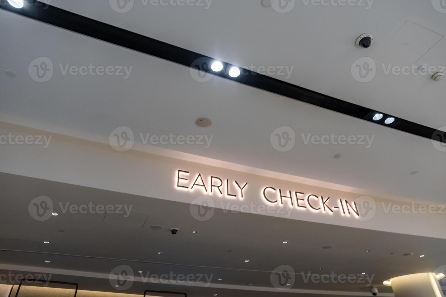 early check-in counter with tourist people try to packing and weight luggage inside Jewel Changi Airport photo