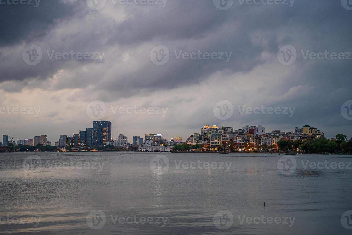 Hanoi, Vietnam - 25 Jun 2024 West Lake in Hanoi in the dark cloudy evening. Ha Noi cityscape. Travel concept photo