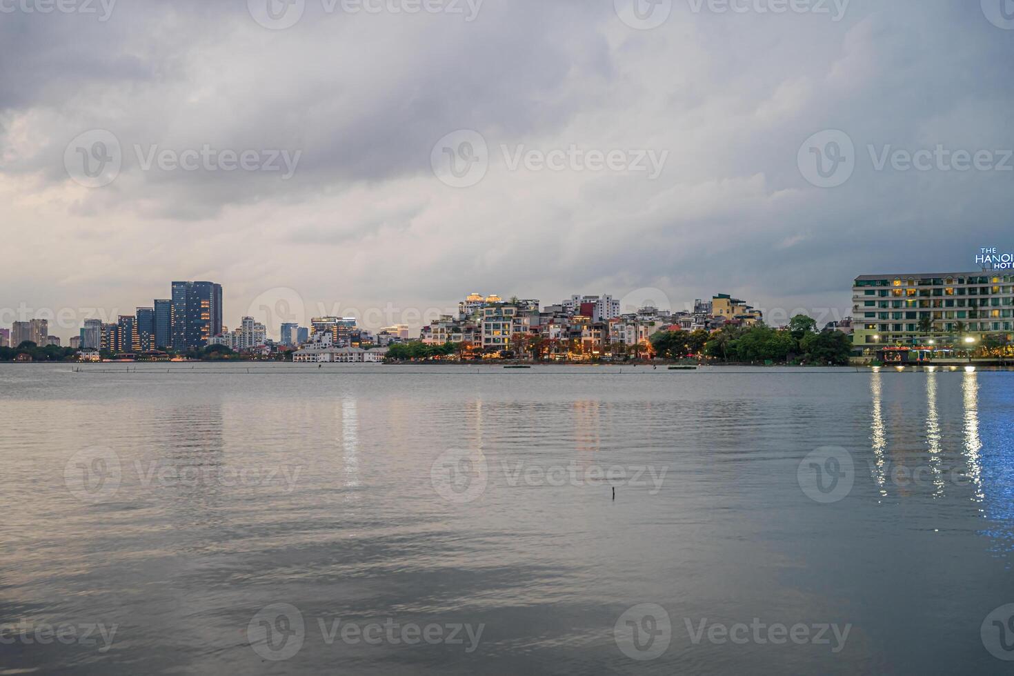 Hanoi, Vietnam - 25 Jun 2024 West Lake in Hanoi in the dark cloudy evening. Ha Noi cityscape. Travel concept photo