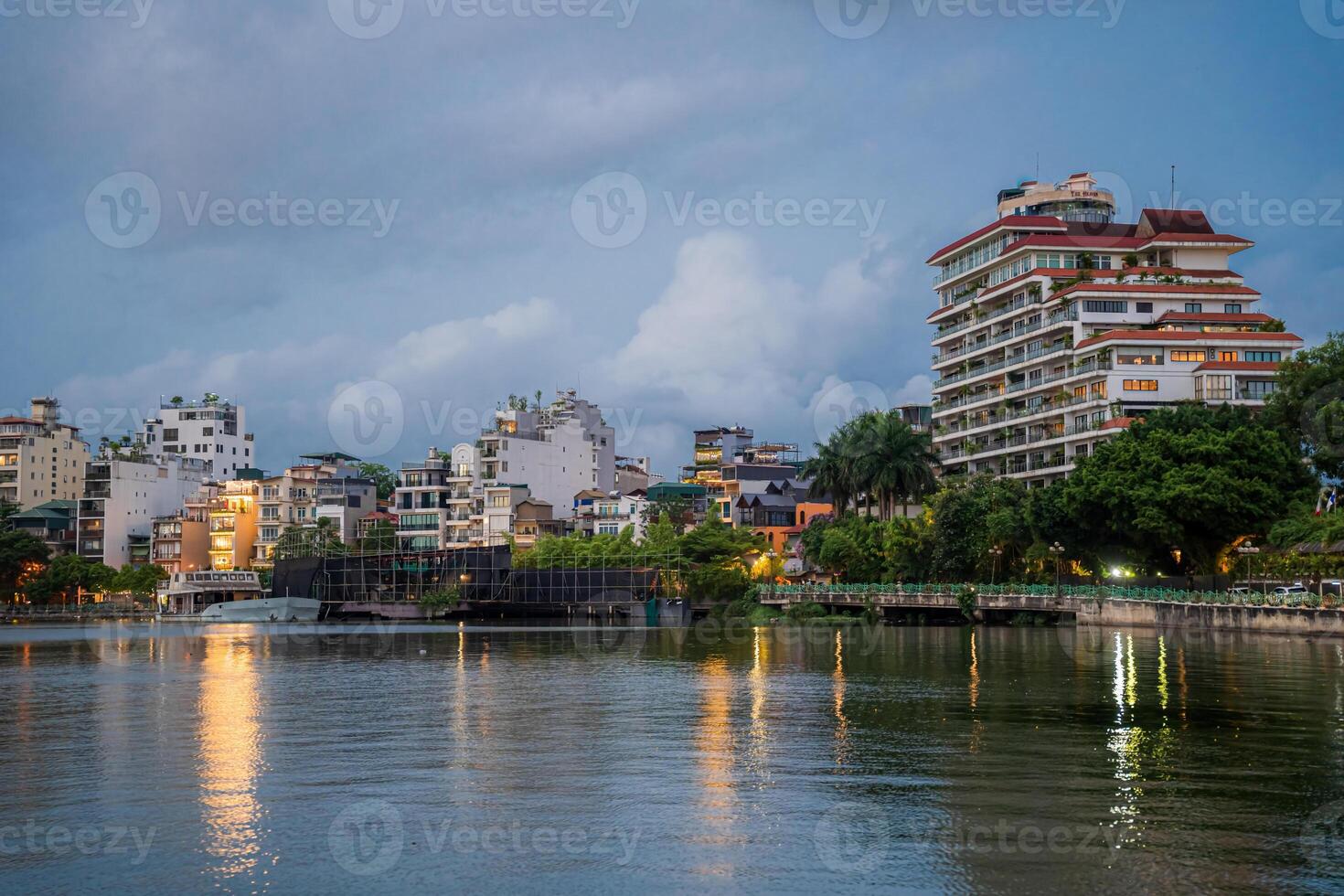 Hanoi, Vietnam - 25 Jun 2024 West Lake in Hanoi in the dark cloudy evening. Ha Noi cityscape. Travel concept photo