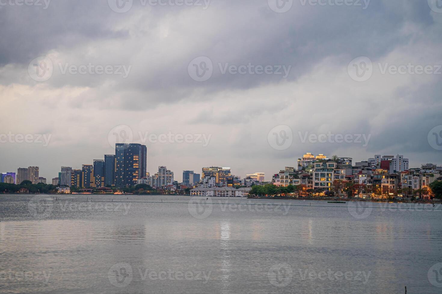 Hanoi, Vietnam - 25 Jun 2024 West Lake in Hanoi in the dark cloudy evening. Ha Noi cityscape. Travel concept photo