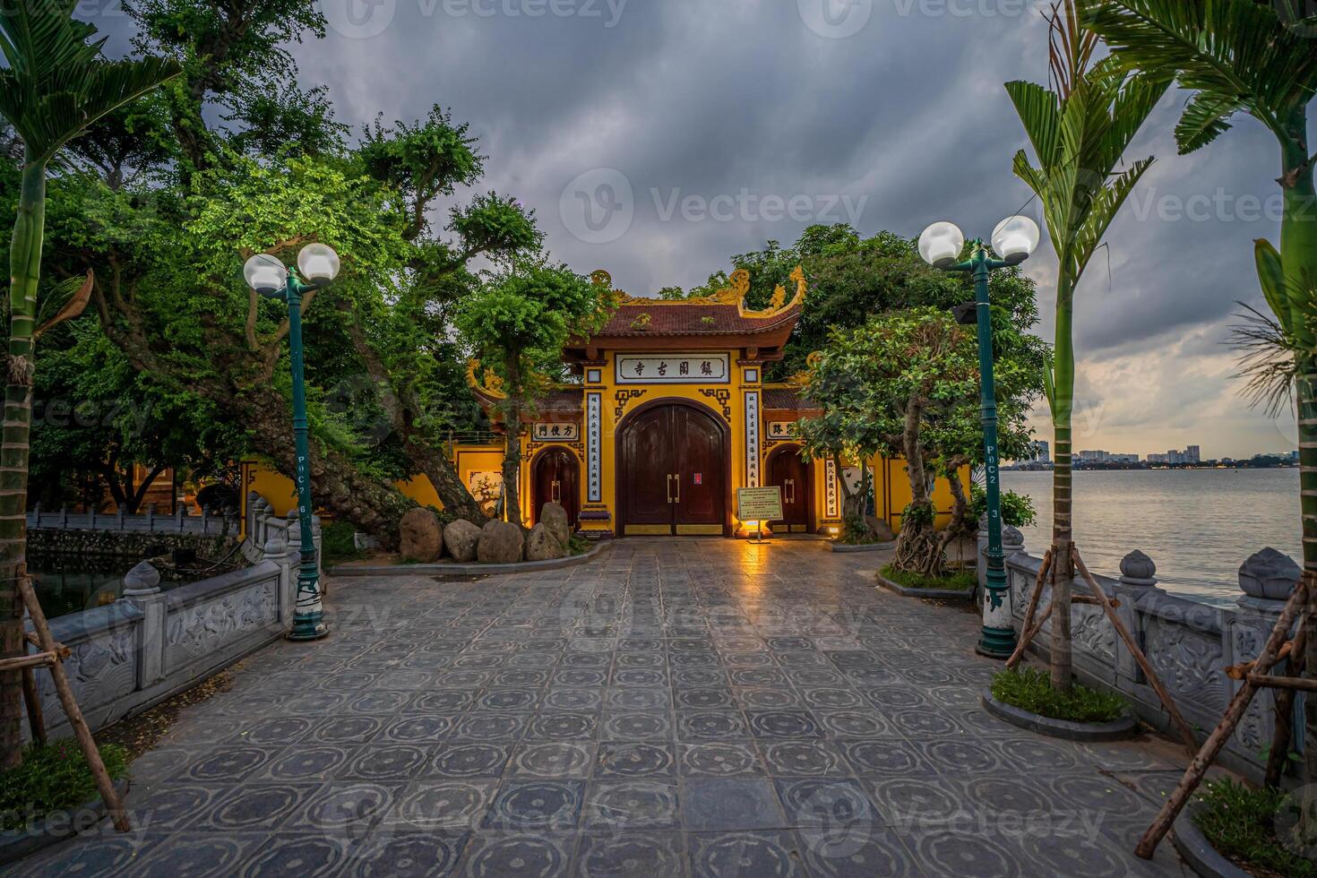 Hanoi, Vietnam - 25 Jun 2024 Tran Quoc Pagoda, the oldest Buddhist temple in Hanoi, is located on a small island near the southeastern shore of West Lake, Hanoi, Vietnam. photo