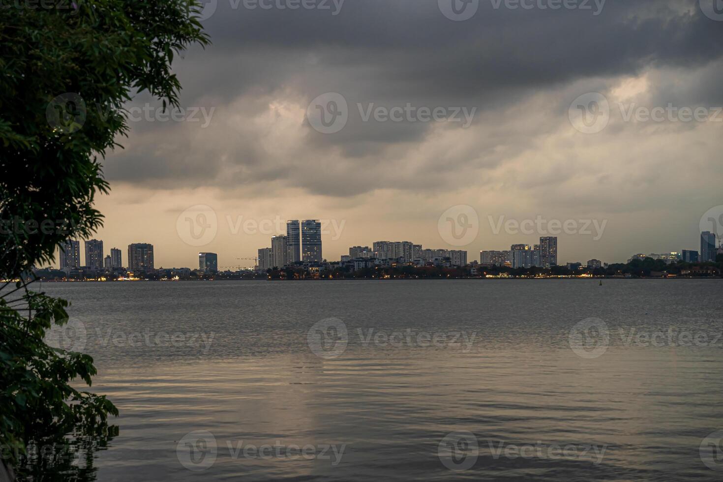 Hanoi, Vietnam - 25 Jun 2024 West Lake in Hanoi in the dark cloudy evening. Ha Noi cityscape. Travel concept photo