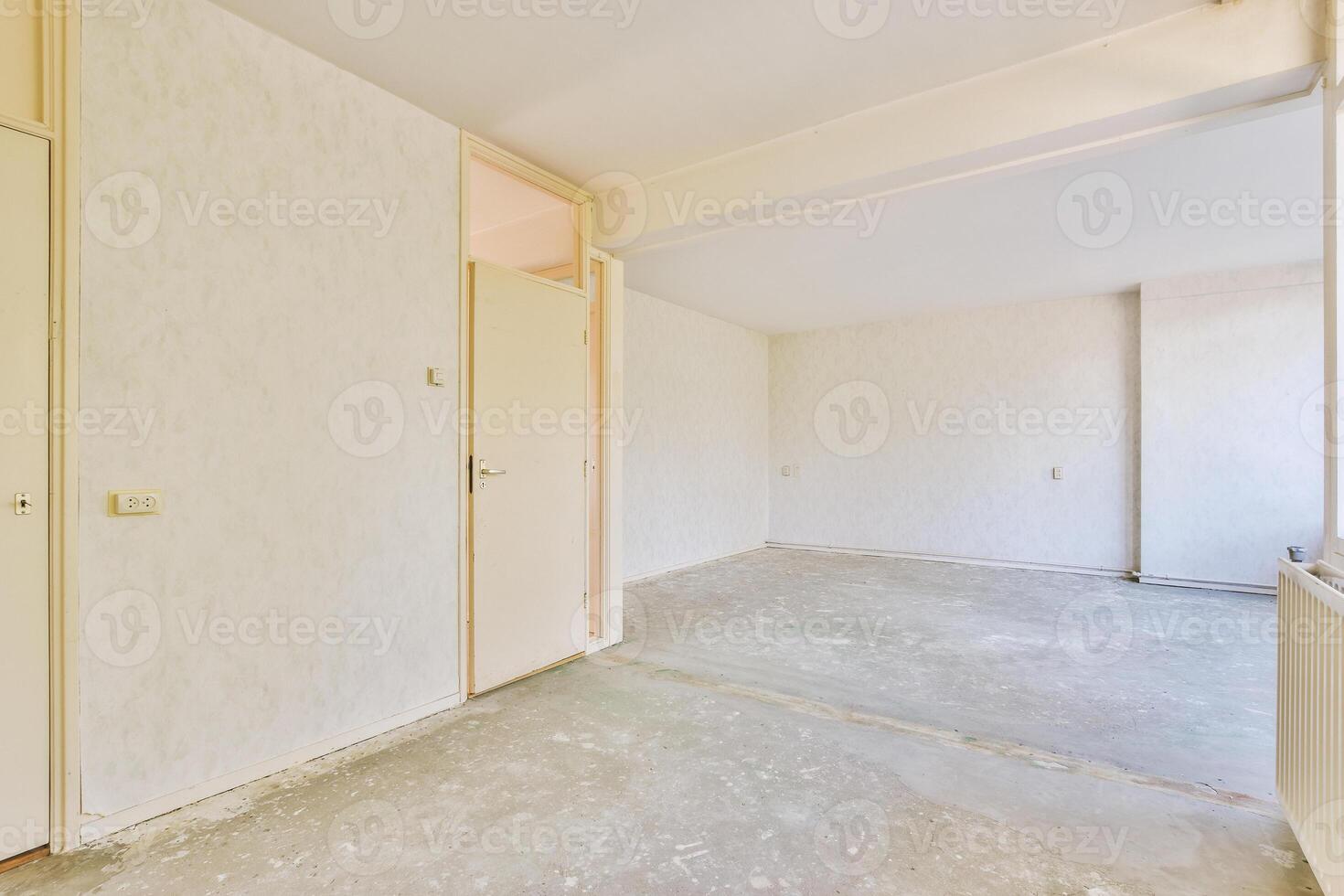 An empty room with a door and a window photo