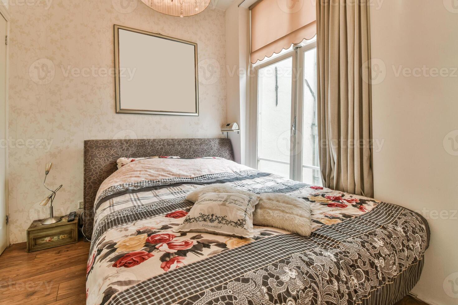 A bedroom with a bed and a window photo