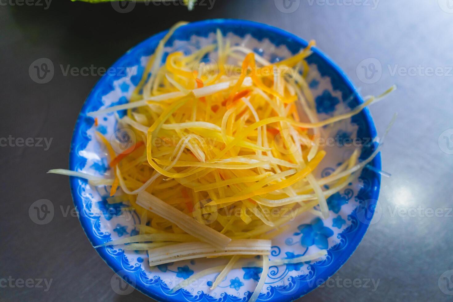 Shredded papaya served with Vung Tau pancakes. A famous dish in Vietnam. photo