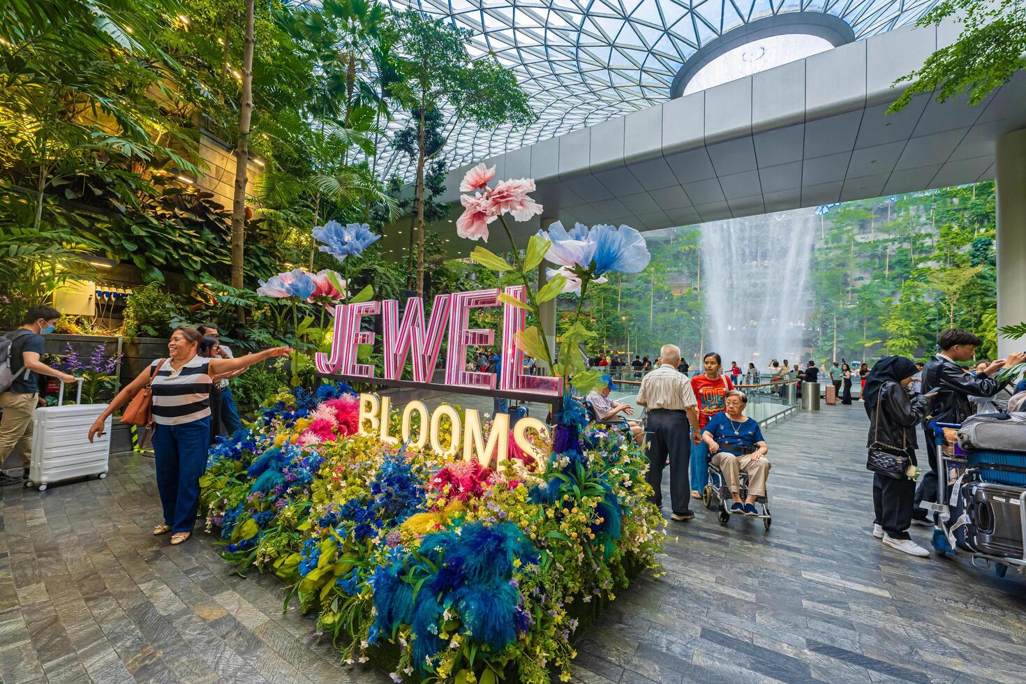 Singapore - Jun 13 2024 The Rain Vortex, a 40m-tall indoor waterfall located inside the Jewal Changi Airport in Singapore. Travel concept photo
