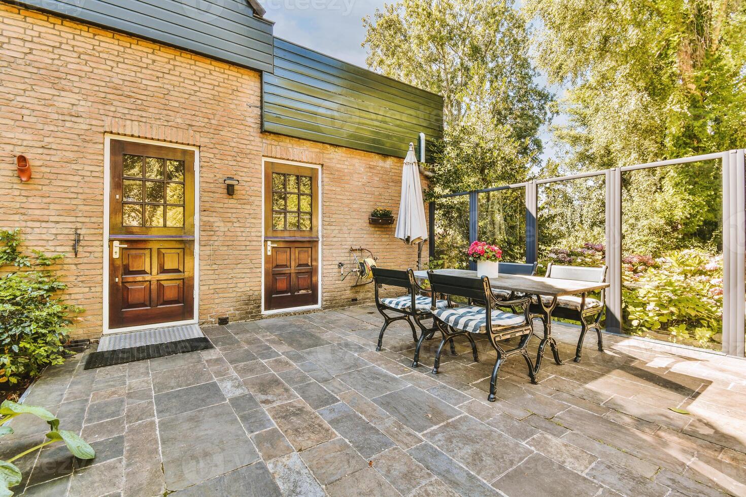 A patio with a table and chairs photo