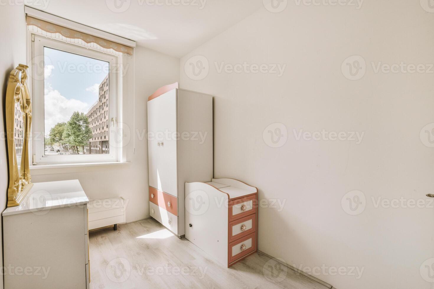 A small room with a bed, a dresser and a window photo