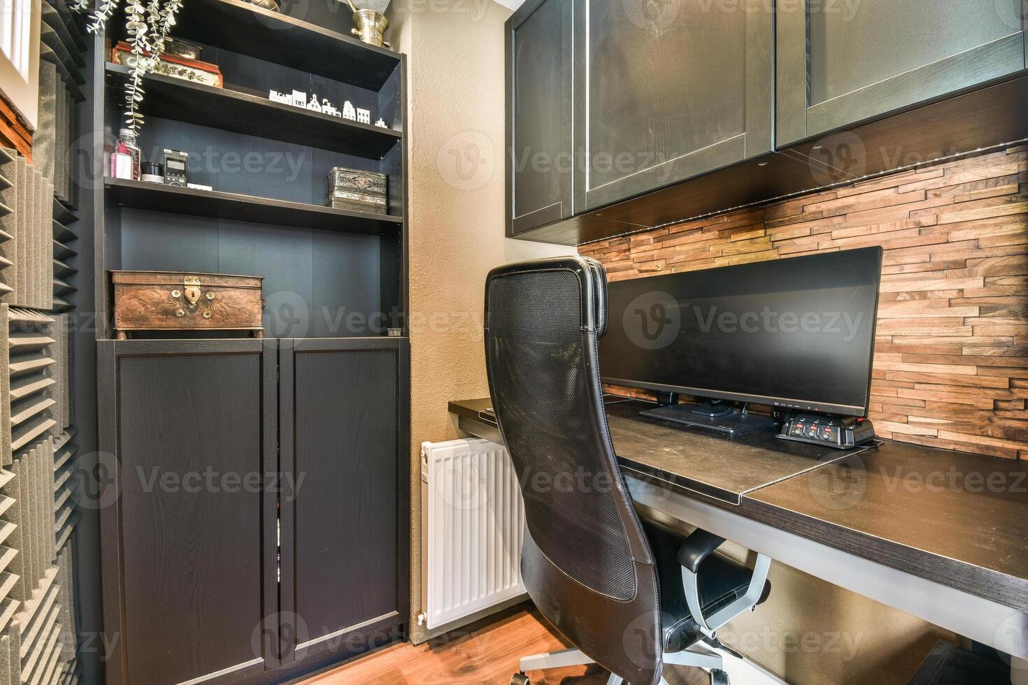 A home office with a desk and computer photo