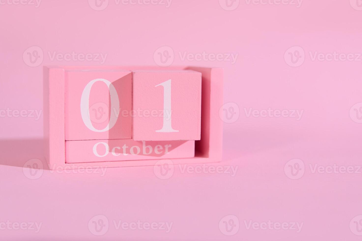 rosado calendario bloques demostración octubre Primero en un minimalista pastel rosado antecedentes simbolizando un Fresco comienzo a el mes. foto