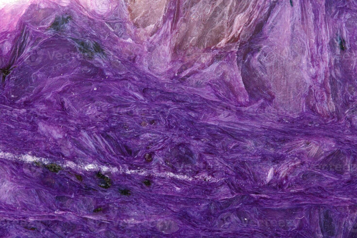 macro mineral stone Charoite on a white background photo