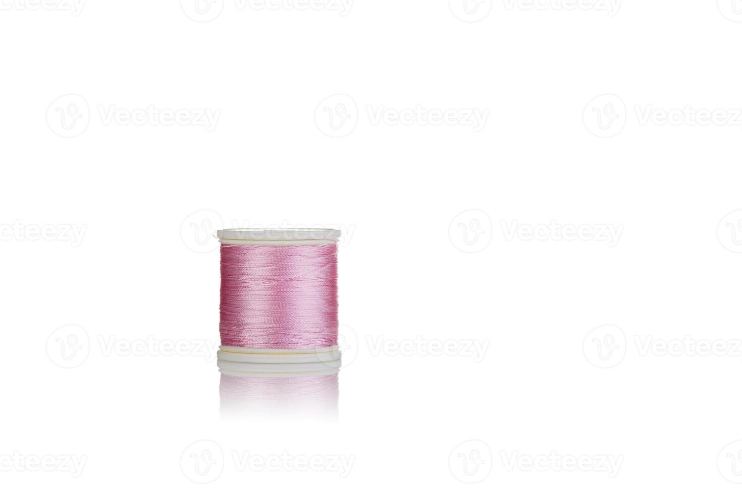 skein of thread pink colors macro on a white background photo