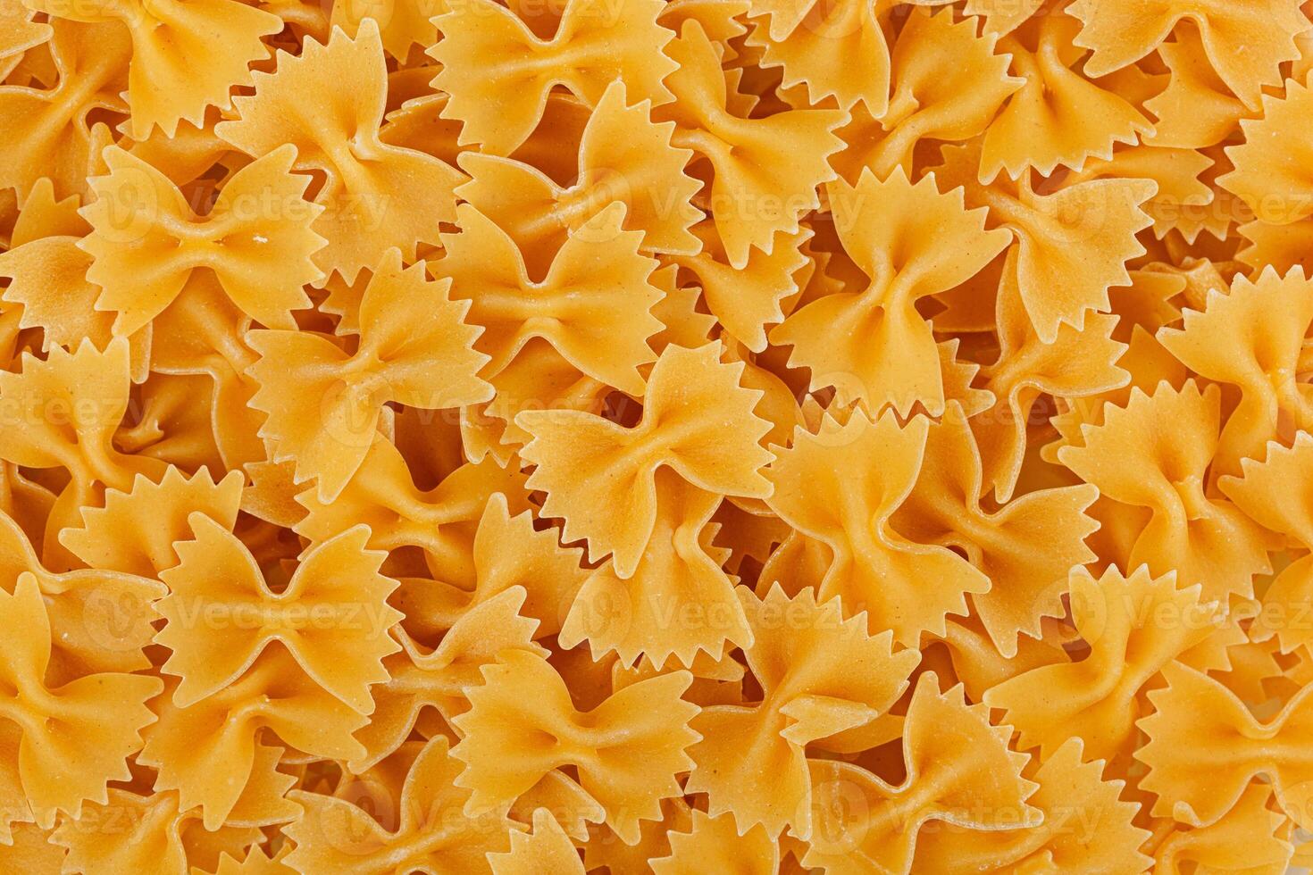 Different types and shapes of dry italian pasta photo