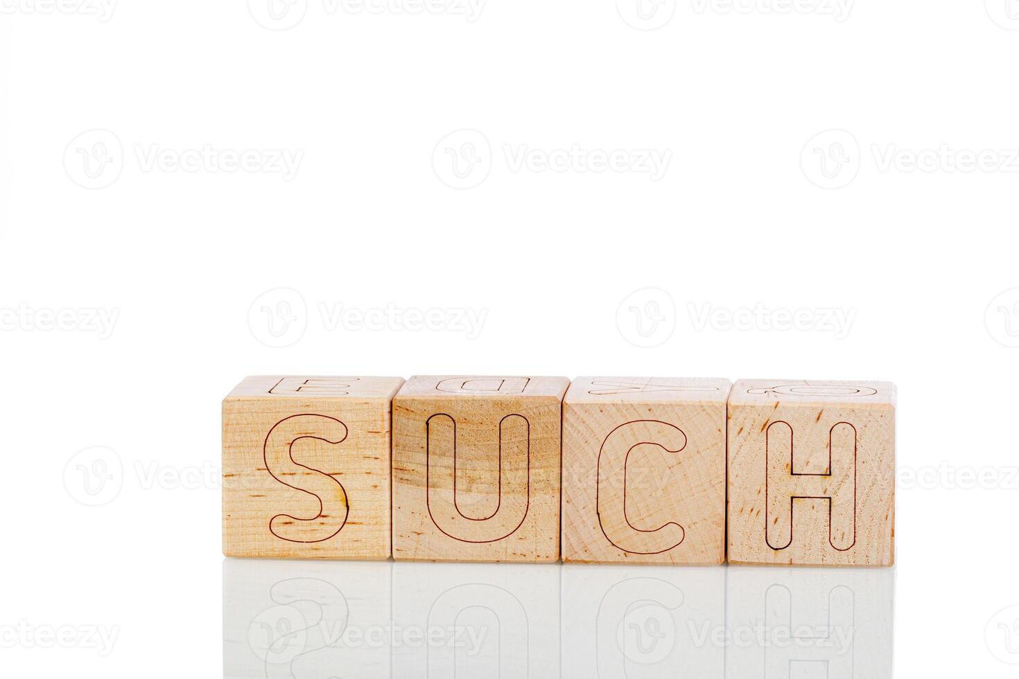 Wooden cubes with letters such on a white background photo